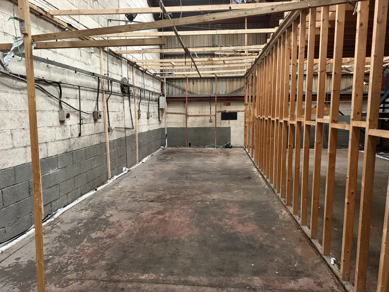 Industrial unit in Coventry cleared of a cannabis farm, leaving bare walls and the timber frame