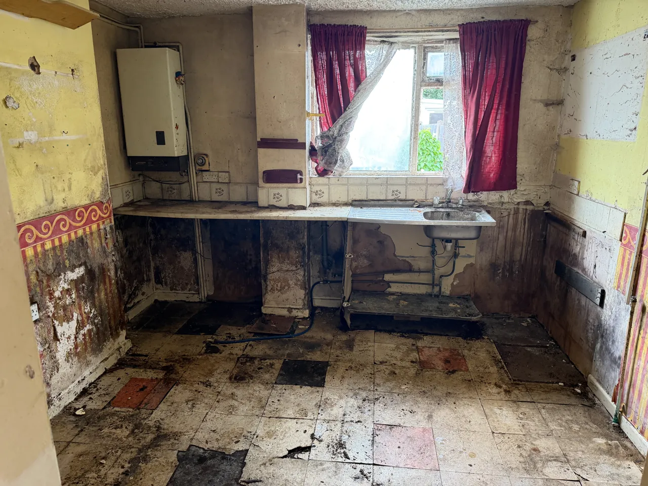 DrClear team clearing a flat kitchen in Walsall, West Midlands, stripped back to the walls and floor
