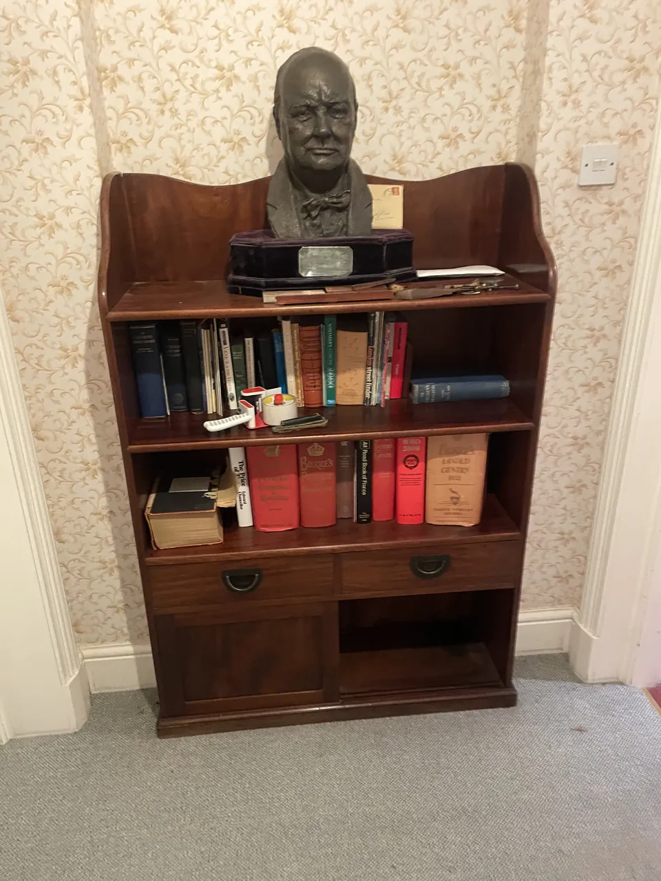 DrClear team clearing an estate in Tamworth, Staffordshire, with a bookcase and bronze bust in the hallway